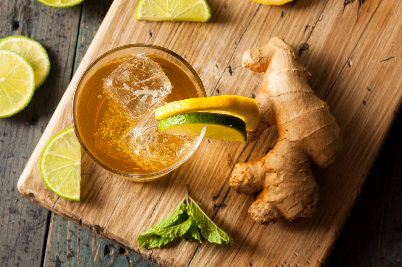 Ginger ale top view in glass with lime and lemone, ginger root on the side