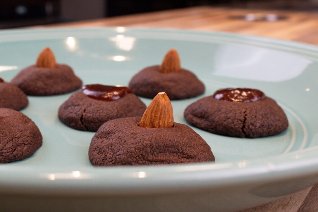 Mini Nests with Almonds (sádlovky) on the blue plate, side detail shot