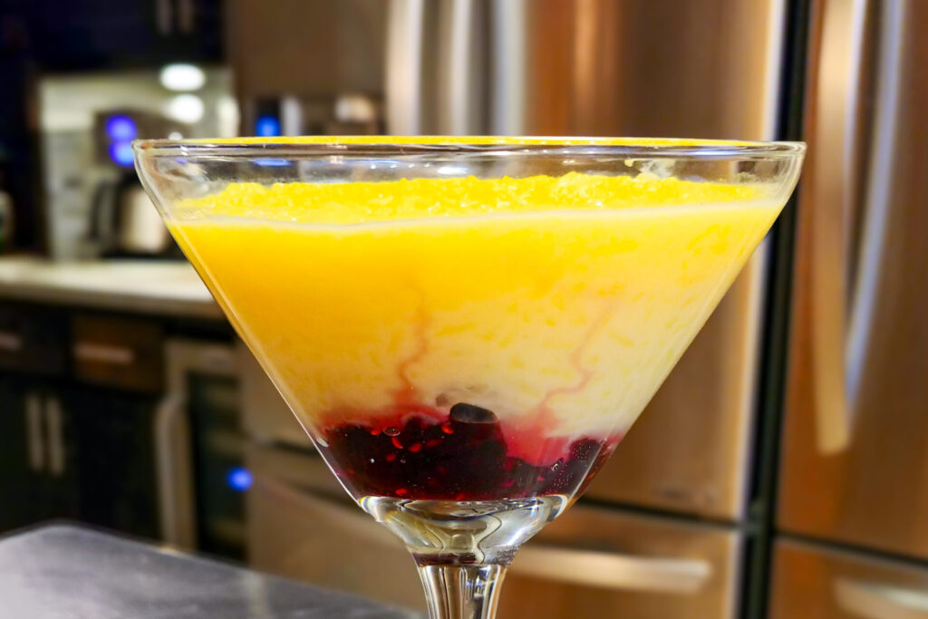 Rice Pudding with Preserve Rýžový Nákyp in detail shot with kitchen in the background, side close shot